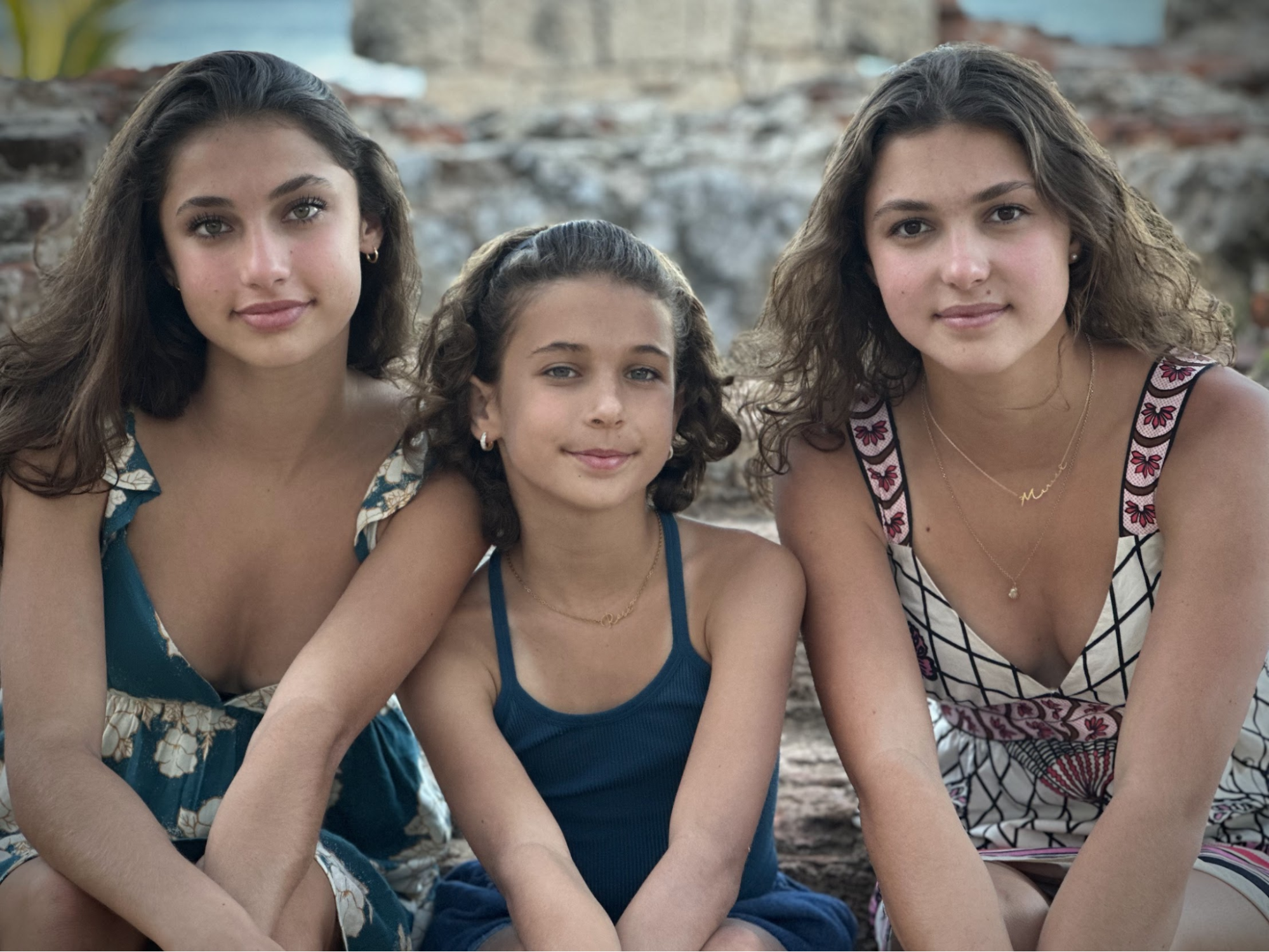 Three sisters smiling