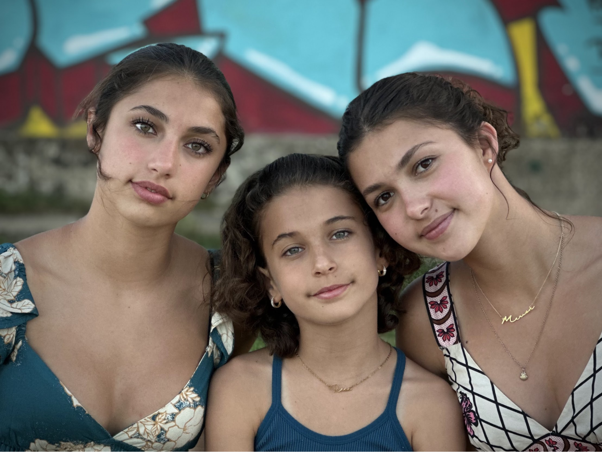 Three sisters reading books together