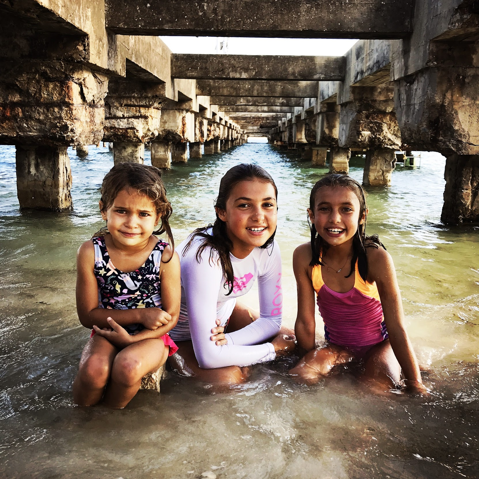12 - Three sisters playing under a pier in Vieques